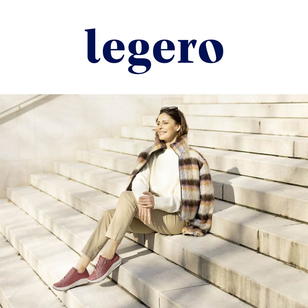 elegant woman sitting on stairs wearing legero aw25 shoes