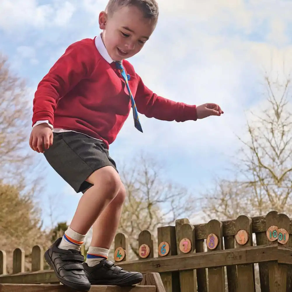 boy with a basketball with school shoes and school uniform collection tile